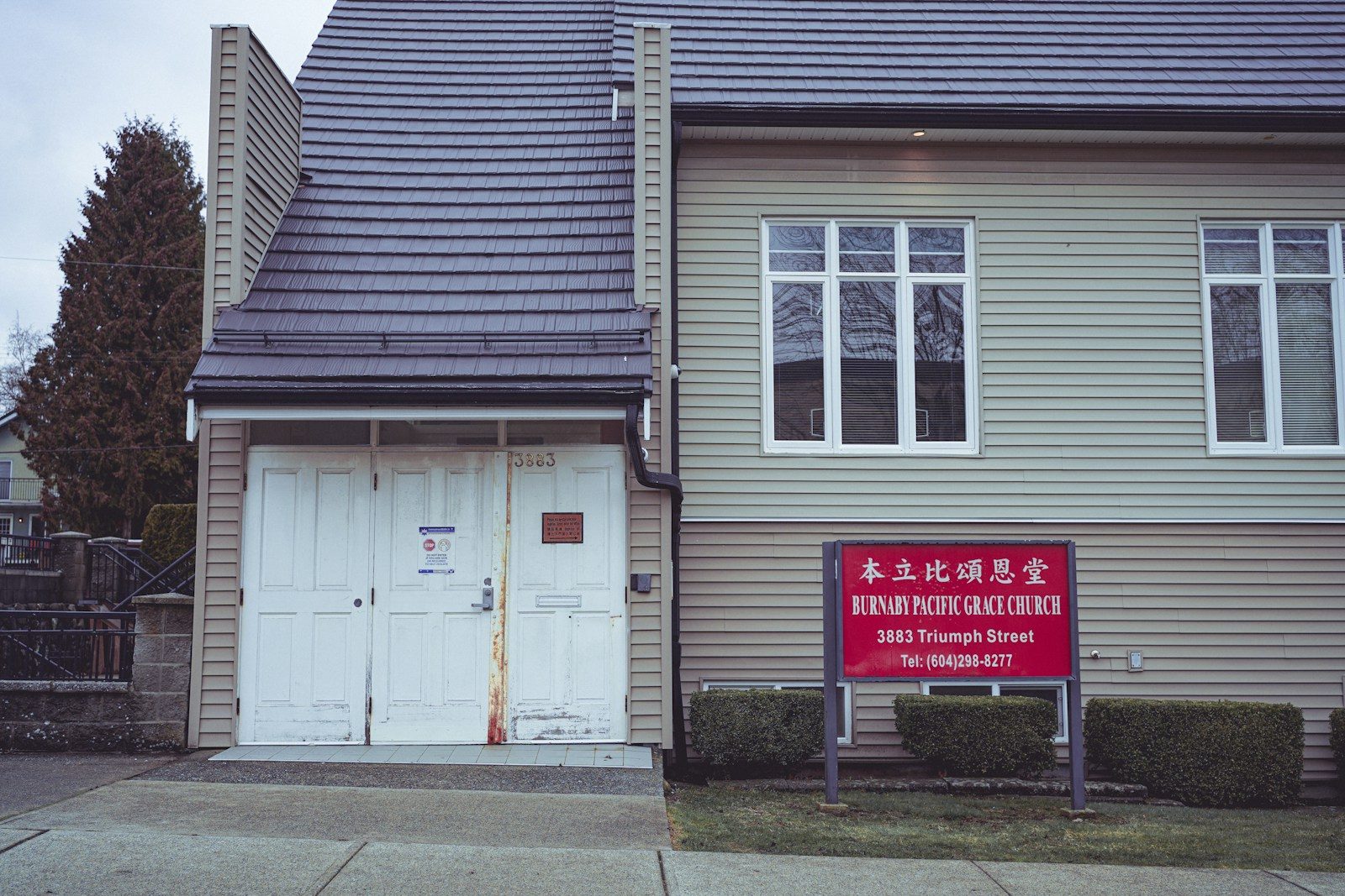 a house with a sign in front of it